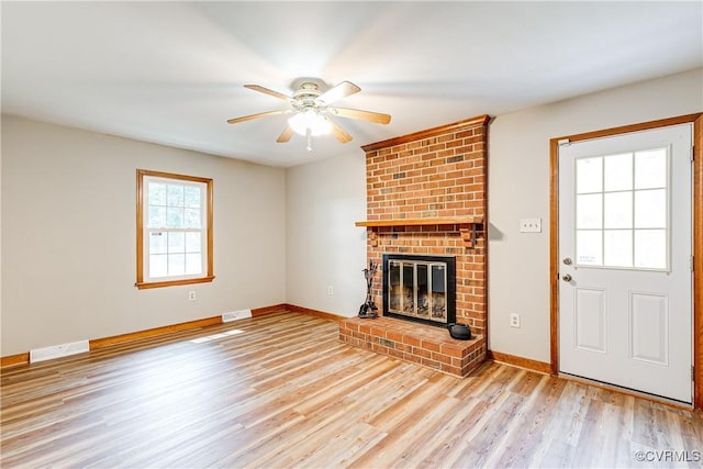5412 Ridgerun Ter, Chesterfield, VA 23832 - unfurnished living room with ceiling fan, light wood-style floors, and a brick fireplace