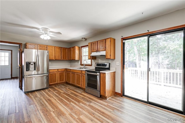 5412 Ridgerun Ter, Chesterfield, VA 23832 - kitchen with stainless steel appliances, under cabinet range hood, light countertops, light wood-style floors, and ceiling fan