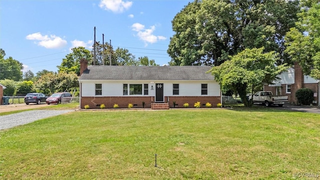 2207 Craven Ln, Henrico, VA 23228 - single story home featuring brick siding, entry steps, a front yard, a chimney, and gravel driveway
