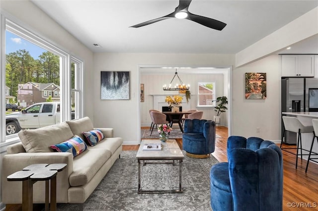 2207 Craven Ln, Henrico, VA 23228 - living area with wood finished floors, a chandelier, and a ceiling fan