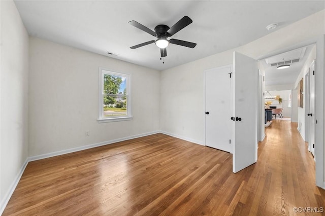 2207 Craven Ln, Henrico, VA 23228 - unfurnished bedroom featuring attic access, wood finished floors, and a ceiling fan