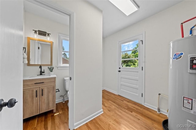 2207 Craven Ln, Henrico, VA 23228 - entryway featuring electric water heater and light wood-style floors