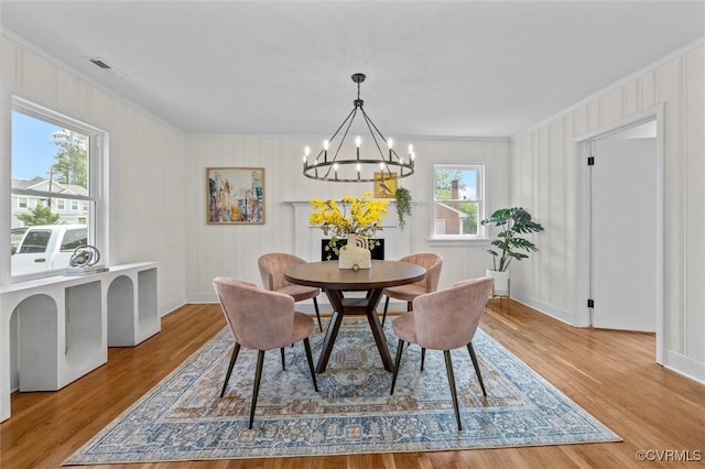 2207 Craven Ln, Henrico, VA 23228 - dining room featuring ornamental molding, a chandelier, and wood finished floors