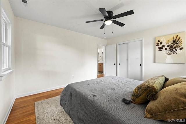 2207 Craven Ln, Henrico, VA 23228 - bedroom with wood finished floors, a closet, and ceiling fan