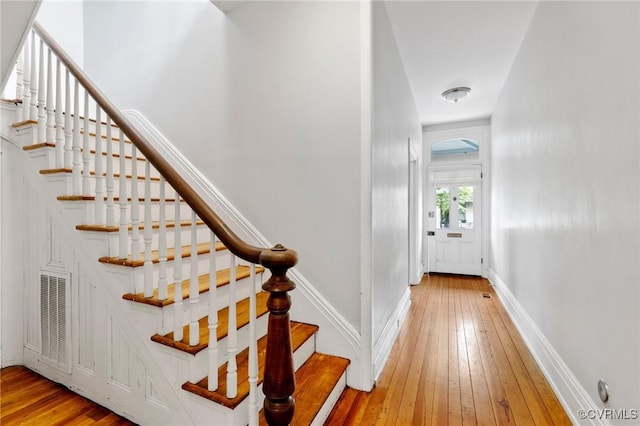 2502 E Grace St, Richmond, VA 23223 - stairs with hardwood / wood-style floors and baseboards