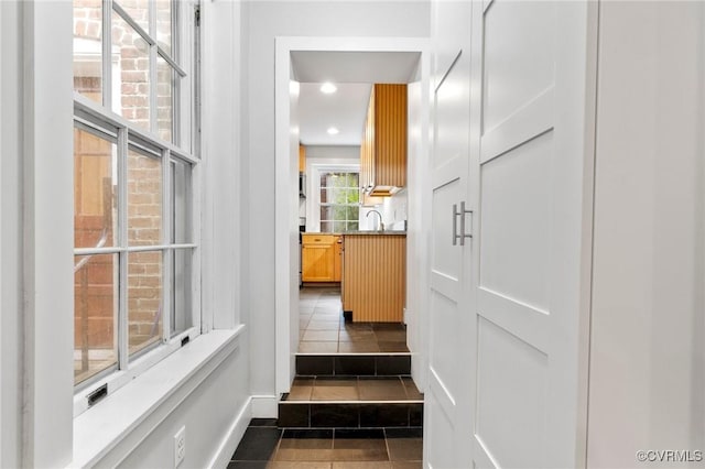2502 E Grace St, Richmond, VA 23223 - hall featuring recessed lighting and dark tile patterned flooring