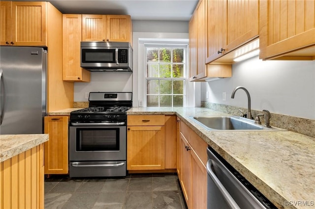 2502 E Grace St, Richmond, VA 23223 - kitchen with appliances with stainless steel finishes and light countertops