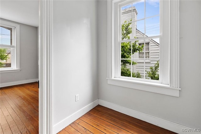 2502 E Grace St, Richmond, VA 23223 - empty room featuring plenty of natural light and hardwood / wood-style floors