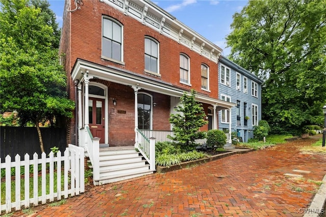 2502 E Grace St, Richmond, VA 23223 - italianate house with brick siding and a porch