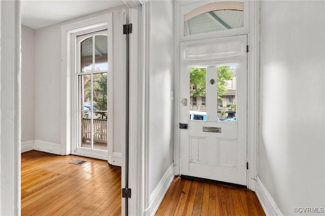 2502 E Grace St, Richmond, VA 23223 - doorway to outside with hardwood / wood-style flooring and plenty of natural light