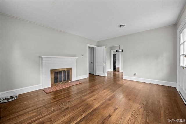914 Kensington Ave, Colonial Heights, VA 23834 - unfurnished living room featuring wood finished floors and a fireplace