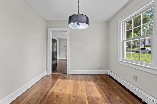 914 Kensington Ave, Colonial Heights, VA 23834 - unfurnished dining area with baseboard heating, crown molding, and dark wood-type flooring