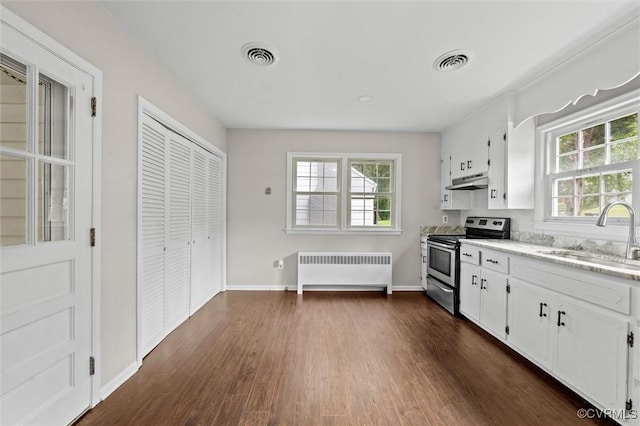 914 Kensington Ave, Colonial Heights, VA 23834 - kitchen featuring stainless steel range with electric stovetop, radiator, dark wood-style flooring, and plenty of natural light