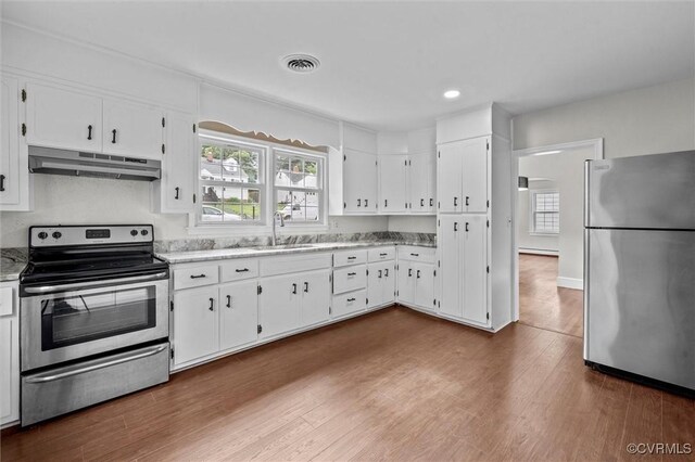 914 Kensington Ave, Colonial Heights, VA 23834 - kitchen with appliances with stainless steel finishes, under cabinet range hood, white cabinets, dark wood-style floors, and recessed lighting