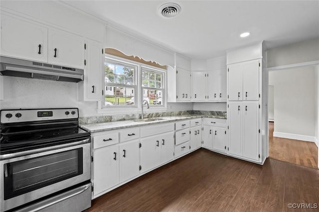 914 Kensington Ave, Colonial Heights, VA 23834 - kitchen with electric range, under cabinet range hood, dark wood-style floors, white cabinetry, and recessed lighting