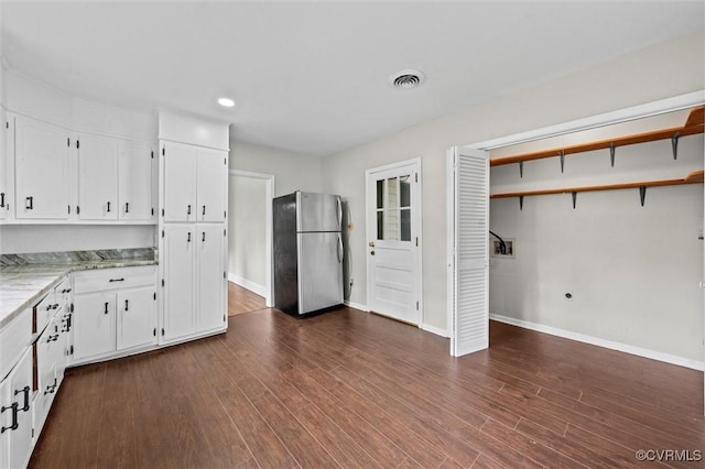 914 Kensington Ave, Colonial Heights, VA 23834 - kitchen featuring freestanding refrigerator, white cabinetry, dark wood finished floors, recessed lighting, and light stone countertops