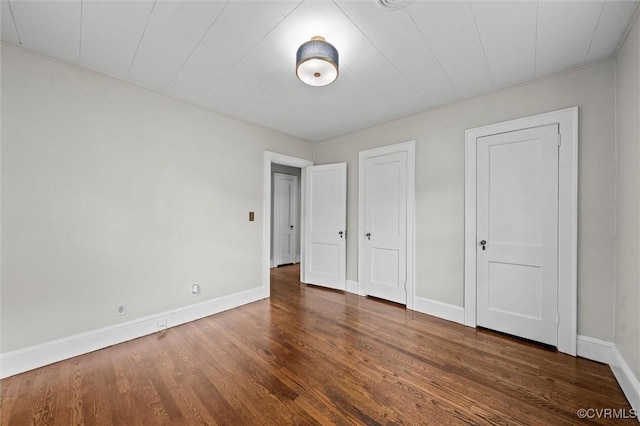 914 Kensington Ave, Colonial Heights, VA 23834 - unfurnished bedroom with baseboards and wood finished floors