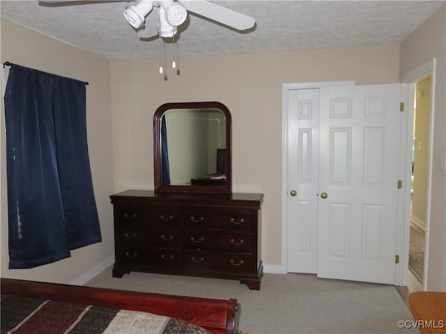 6329 Sledds Lake Rd, Mechanicsville, VA 23111 - carpeted bedroom featuring a textured ceiling, a ceiling fan, and a closet