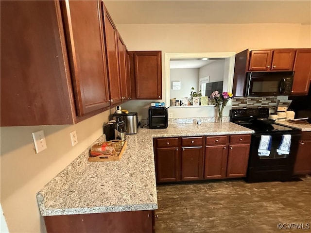 1806 Powhatan Ave, Petersburg, VA 23805 - kitchen with black appliances, light countertops, and backsplash