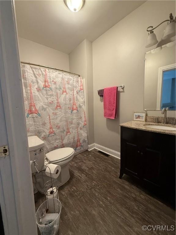 1806 Powhatan Ave, Petersburg, VA 23805 - bathroom featuring vanity, wood finished floors, and a shower with shower curtain