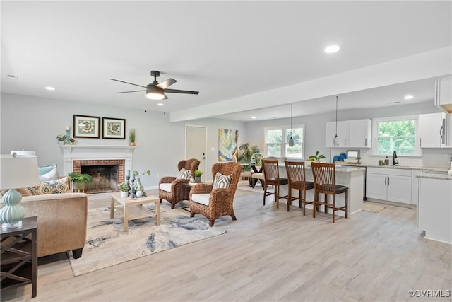 606 Bermuda Hundred Rd, Chester, VA 23836 - living room with healthy amount of natural light, light wood-type flooring, recessed lighting, and a brick fireplace