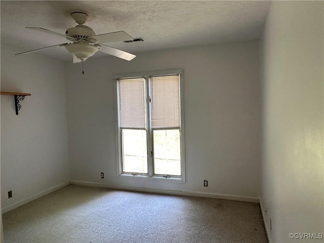 8253 Skirmish Ln, Mechanicsville, VA 23111 - unfurnished room featuring healthy amount of natural light, light carpet, ceiling fan, and a textured ceiling