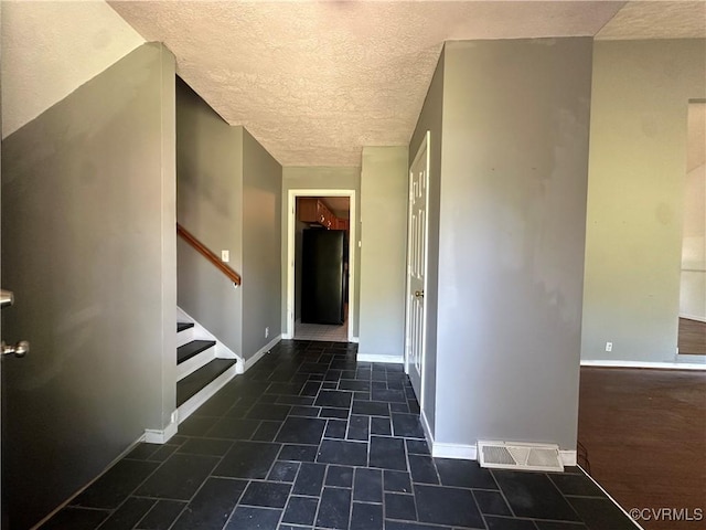 8253 Skirmish Ln, Mechanicsville, VA 23111 - foyer featuring a textured ceiling and stairs