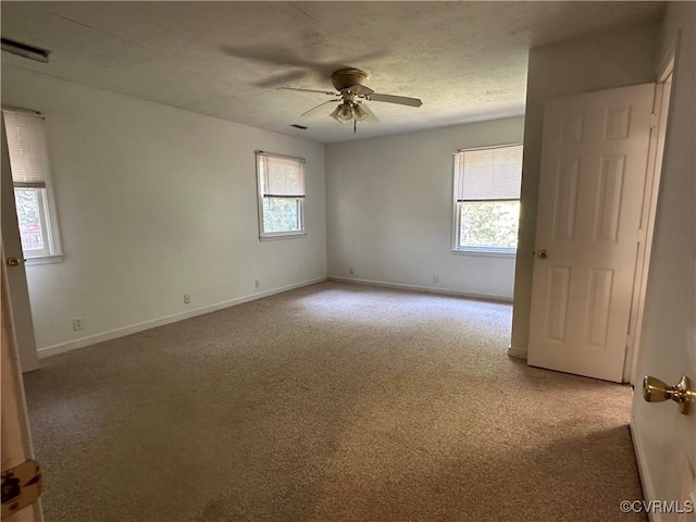 8253 Skirmish Ln, Mechanicsville, VA 23111 - spare room featuring carpet, plenty of natural light, and a ceiling fan