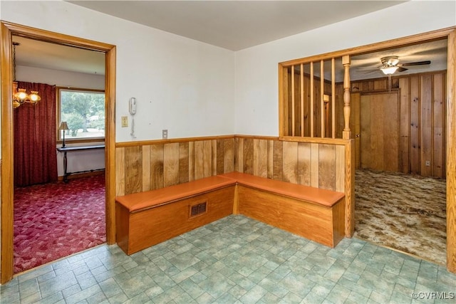 12100 Brookview Dr, Chesterfield, VA 23112 - mudroom with wooden walls, ceiling fan, stone finish flooring, wainscoting, and carpet