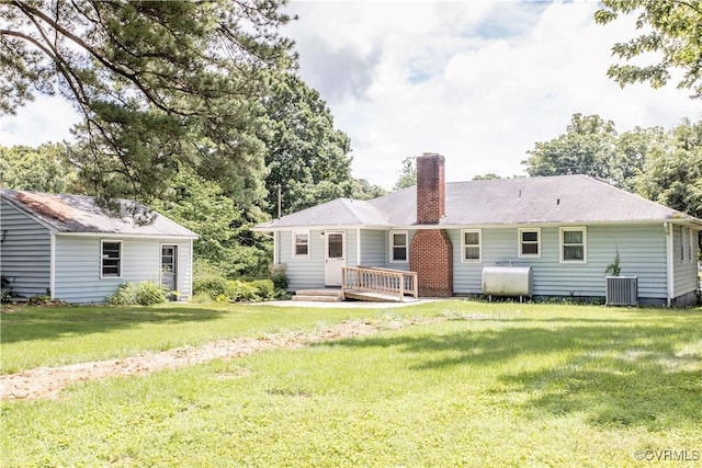 12100 Brookview Dr, Chesterfield, VA 23112 - back of property featuring heating fuel, a chimney, and a yard
