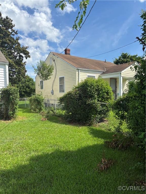 1523 N 29th, Richmond, VA 23223 - view of property exterior with a chimney