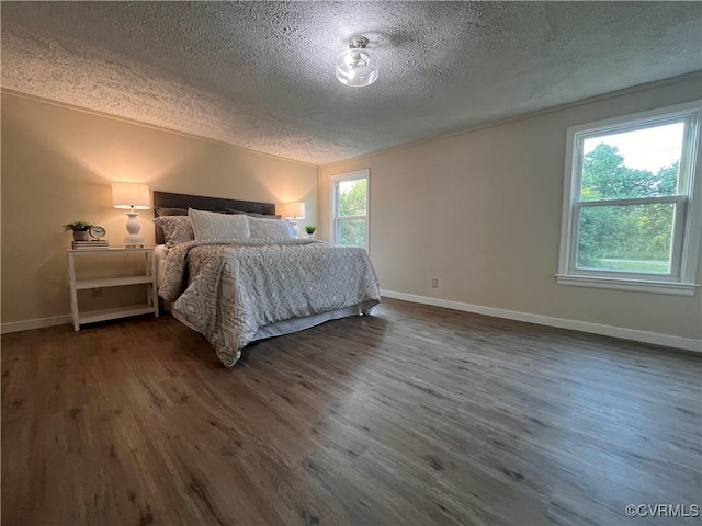 5225 Hopewell Rd, New Kent, VA 23124 - bedroom featuring a textured ceiling, dark wood-style flooring, and vaulted ceiling