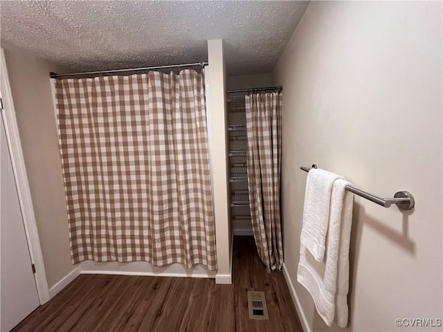 5225 Hopewell Rd, New Kent, VA 23124 - full bath featuring wood finished floors and a textured ceiling