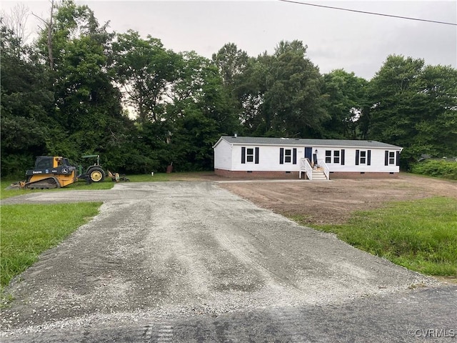 5225 Hopewell Rd, New Kent, VA 23124 - manufactured / mobile home with crawl space, driveway, and a forest view