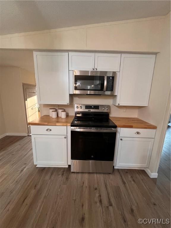5225 Hopewell Rd, New Kent, VA 23124 - kitchen with stainless steel appliances, butcher block countertops, dark wood-type flooring, and white cabinetry