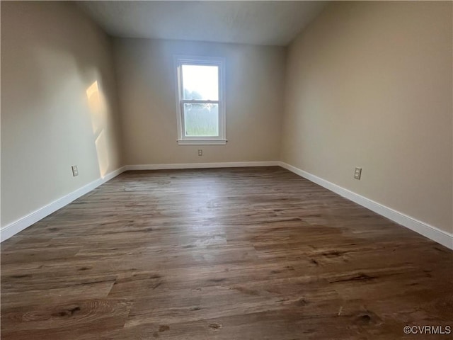 5225 Hopewell Rd, New Kent, VA 23124 - empty room featuring dark wood-style flooring and baseboards