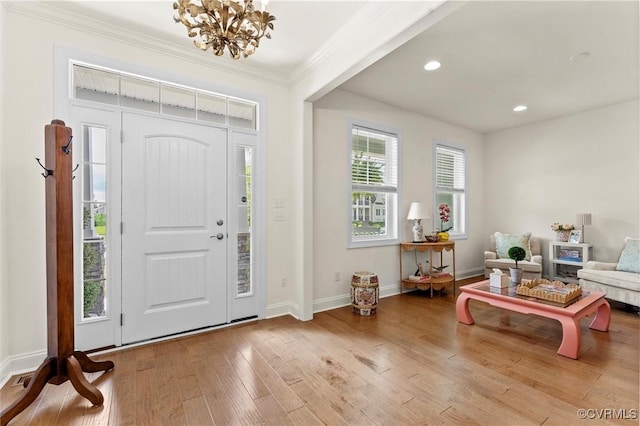 6636 Stonewolf Ct, Moseley, VA 23120 - entryway with a chandelier, crown molding, wood finished floors, and recessed lighting