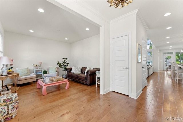 6636 Stonewolf Ct, Moseley, VA 23120 - living area with ornamental molding, recessed lighting, light wood-style floors, and a chandelier