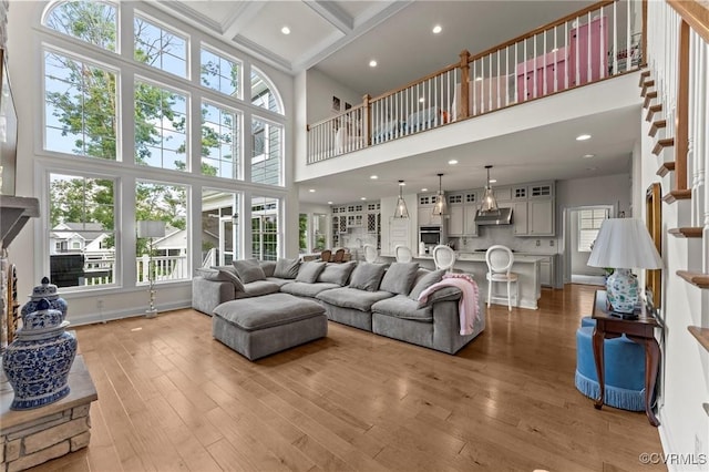 6636 Stonewolf Ct, Moseley, VA 23120 - living area with wood finished floors, a towering ceiling, beam ceiling, and recessed lighting