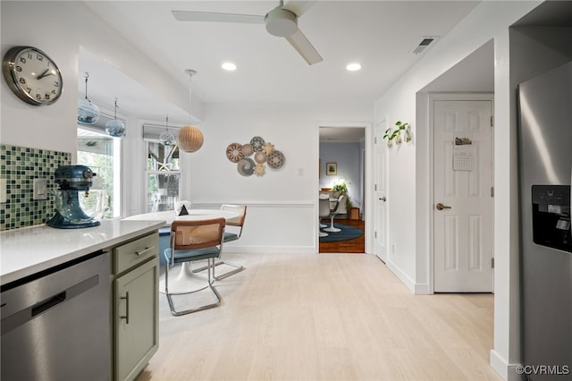 13926 Sagebrook Rd, Midlothian, VA 23112 - kitchen featuring appliances with stainless steel finishes, light wood finished floors, ceiling fan, light countertops, and decorative backsplash