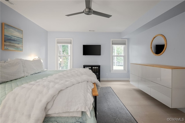 13926 Sagebrook Rd, Midlothian, VA 23112 - bedroom featuring multiple windows, light wood-style flooring, and a ceiling fan