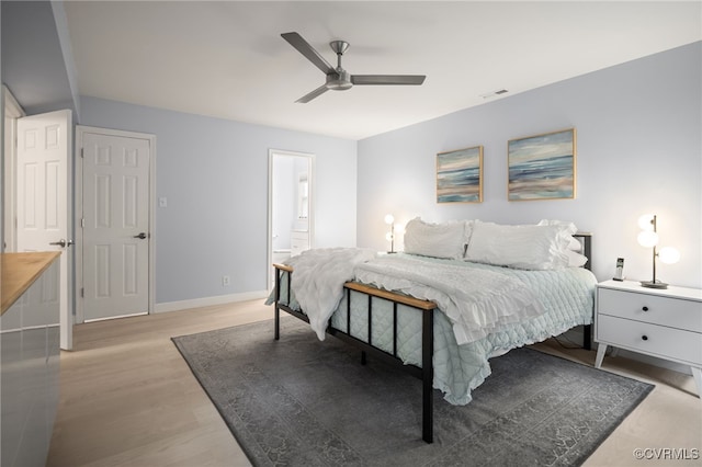 13926 Sagebrook Rd, Midlothian, VA 23112 - bedroom with light wood-style flooring, a ceiling fan, and ensuite bathroom