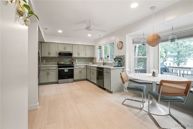 13926 Sagebrook Rd, Midlothian, VA 23112 - kitchen featuring stainless steel appliances, gray cabinetry, backsplash, light wood-style flooring, and ceiling fan