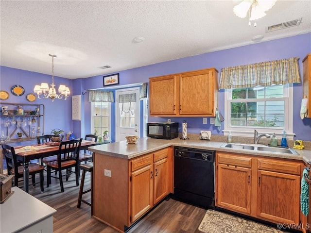 3034 Sara Jean Ter, Glen Allen, VA 23060 - kitchen with black appliances, plenty of natural light, a textured ceiling, a chandelier, and a peninsula