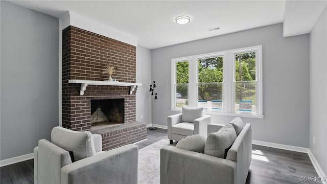 1531 Berkeley Ave, Petersburg, VA 23805 - living room featuring wood finished floors and a fireplace
