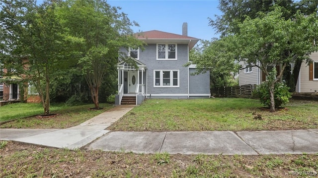1531 Berkeley Ave, Petersburg, VA 23805 - view of front of home featuring a chimney, a front lawn, and stucco siding