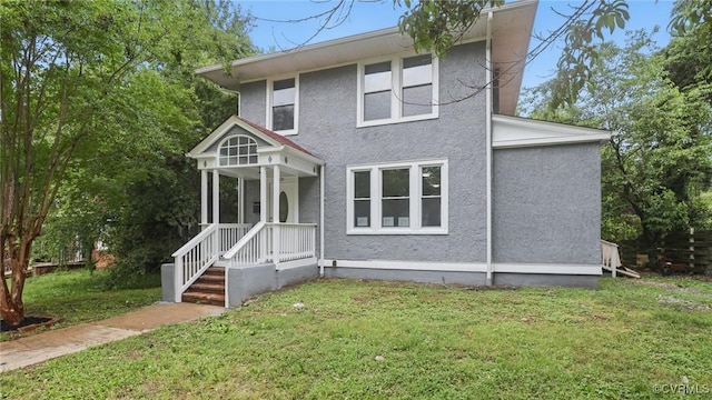 1531 Berkeley Ave, Petersburg, VA 23805 - view of front facade featuring stucco siding and a front yard