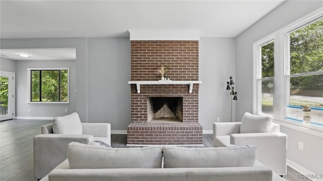 1531 Berkeley Ave, Petersburg, VA 23805 - living area with wood finished floors, plenty of natural light, and a fireplace