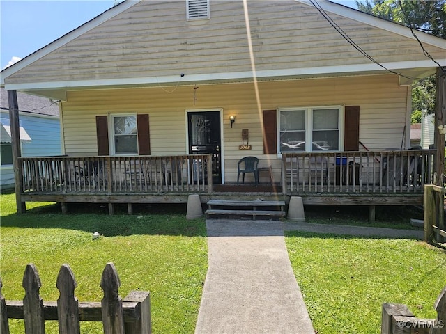1048 Amelia St, Petersburg, VA 23803 - bungalow with a porch and a front lawn