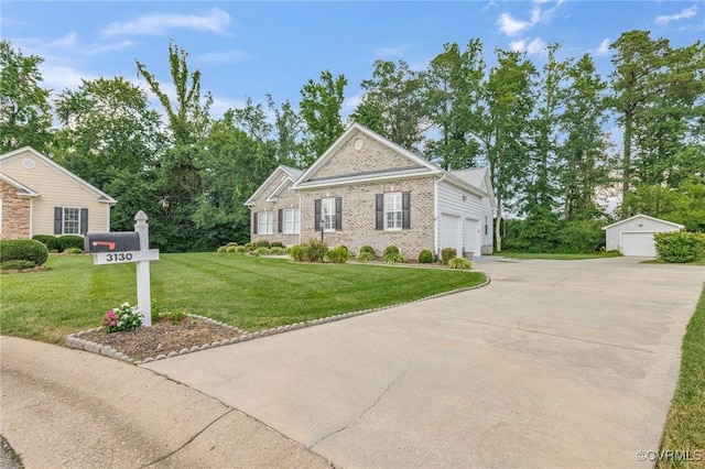 3130 Tinsley Ter, Prince George, VA 23875 - view of front facade with a front yard, brick siding, concrete driveway, an outbuilding, and an attached garage